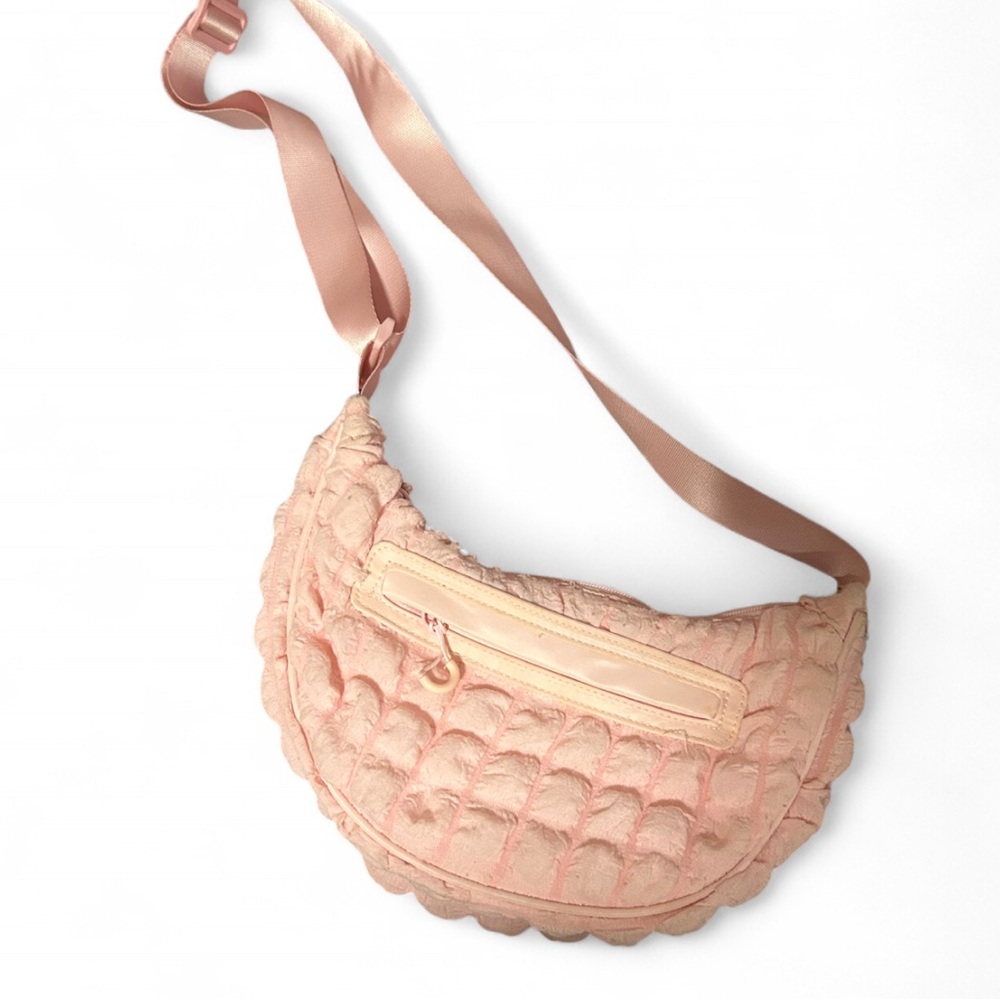 pink buffer bag with adjustable straps.